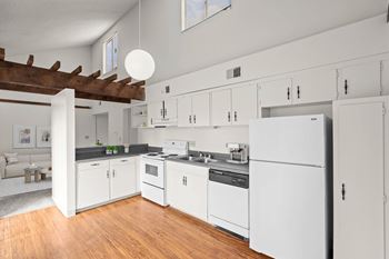 Modern kitchen with a refrigerator at Bremerton Park Apartments Homes in Prairie Village, Kansas